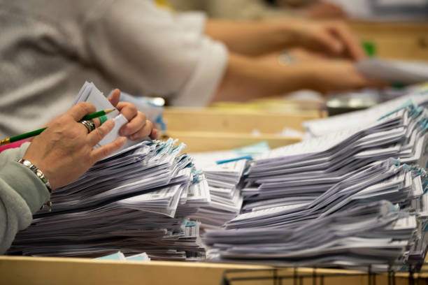 live election results WA 2025 a close up of ballot papers being counted during an election
